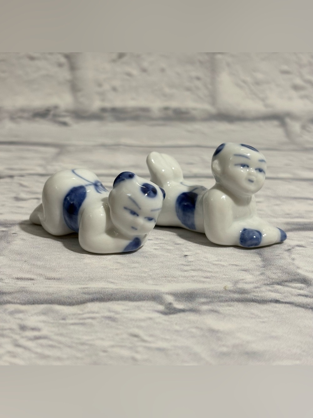 Vintage Japanese porcelain crawling baby chopstick rests (2 count)